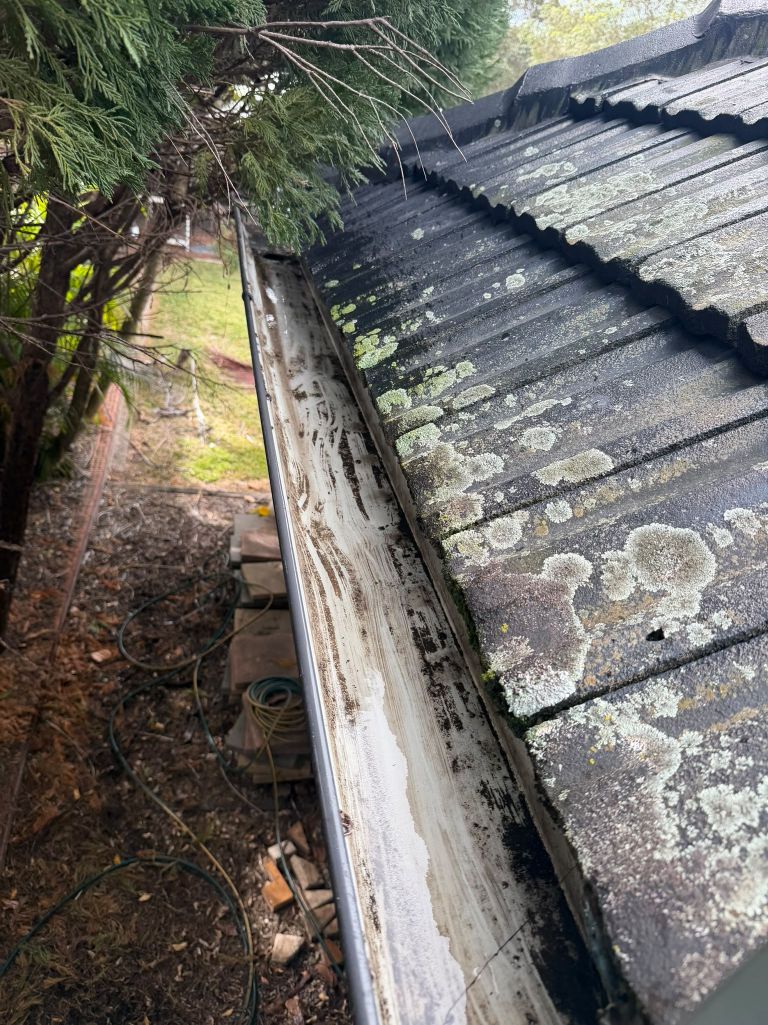 After gutter cleaning - Debris and silt removed, free-flowing again