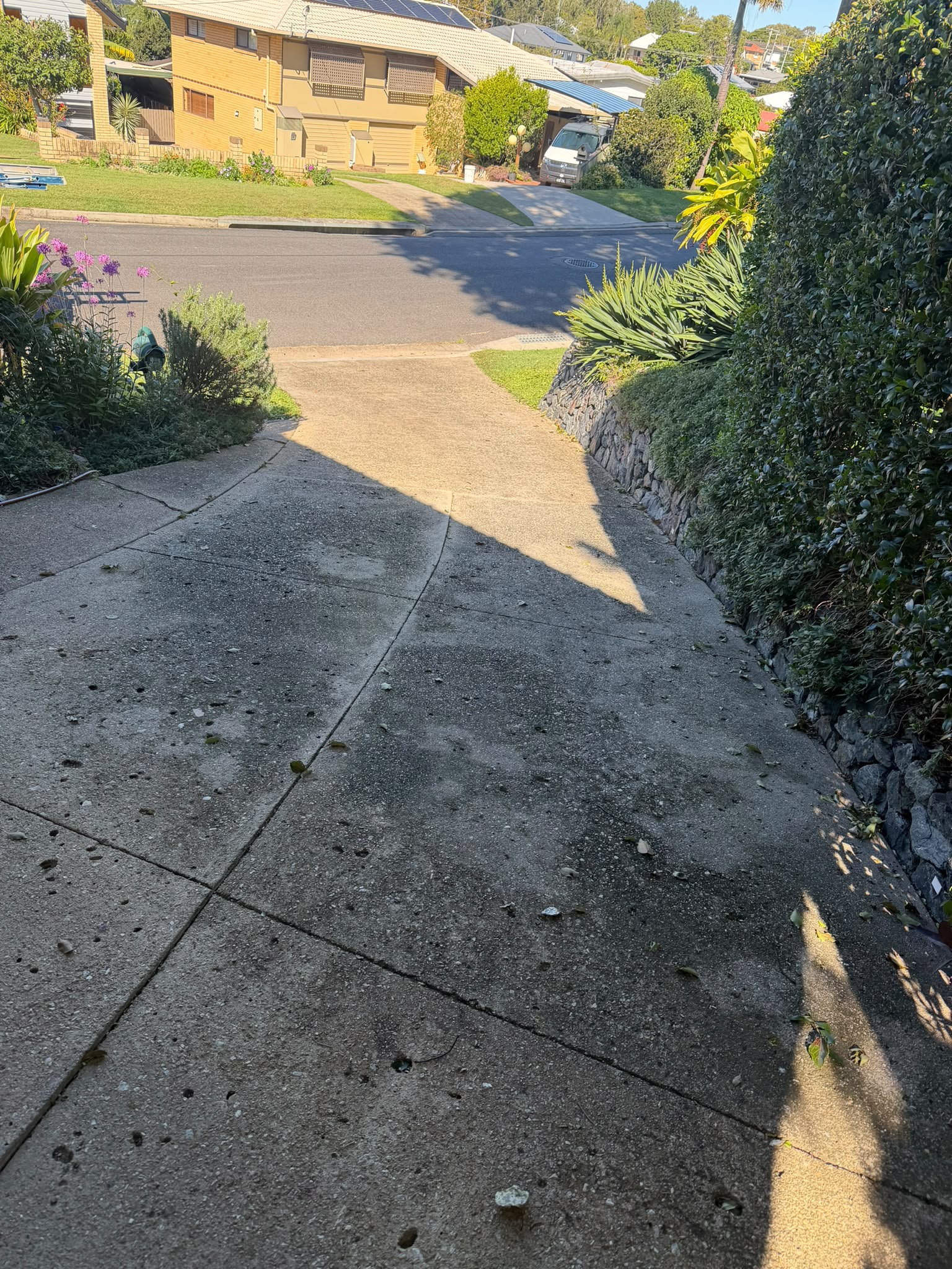 Before driveways - Freshened hardstand area with a cleaner, brighter finish